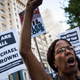 Protesters hold a rally in New York City Aug. 18, 2014, in solidarity with the people of Ferguson, Mo., protesting the death of Michael Brown and the excessive use of force by police.
Andrew Burton/Getty Images